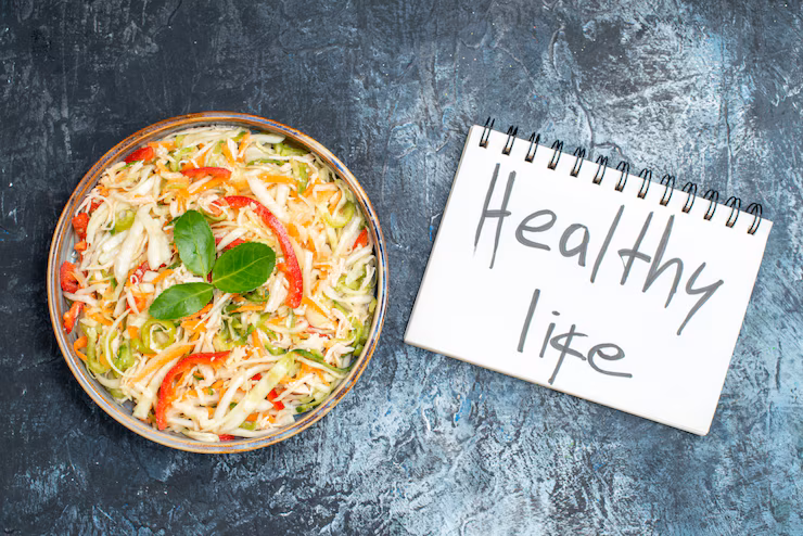 top-view-delicious-vegetable-salad-with-healthy-life-writing-grey-background_140725-125771